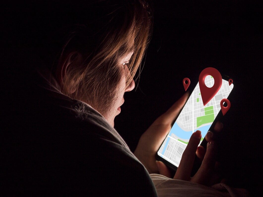 A side profile of a woman holding a smartphone reveals a map on the screen with visible location pins.